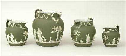 Appraisal: Four Wedgwood Green Jasperware Pitchers Marked to in