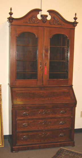 Appraisal: AMERICAN ROCOCO REVIVAL WALNUT SECRETARY BOOKCASE Top member with arched