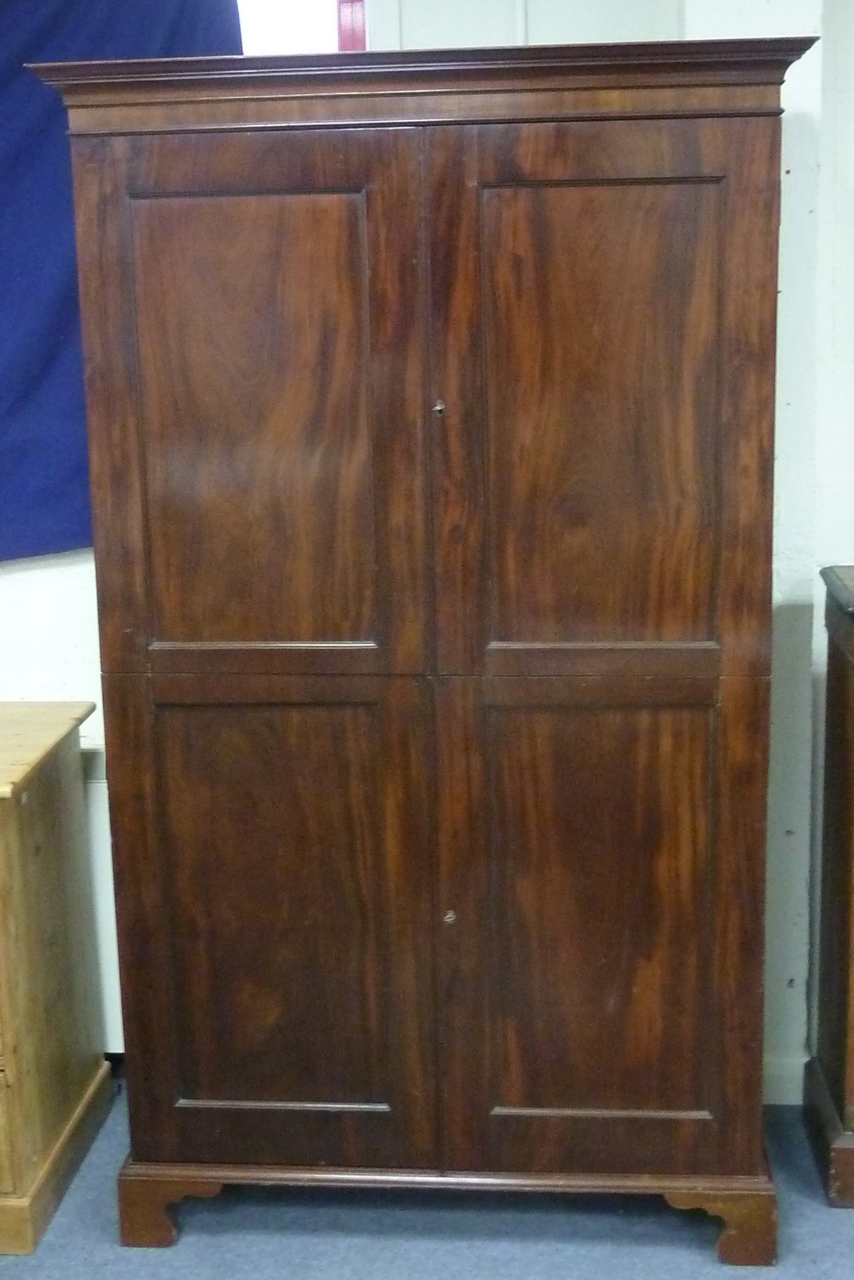 Appraisal: A th Century mahogany cupboard the moulded cornice above panelled