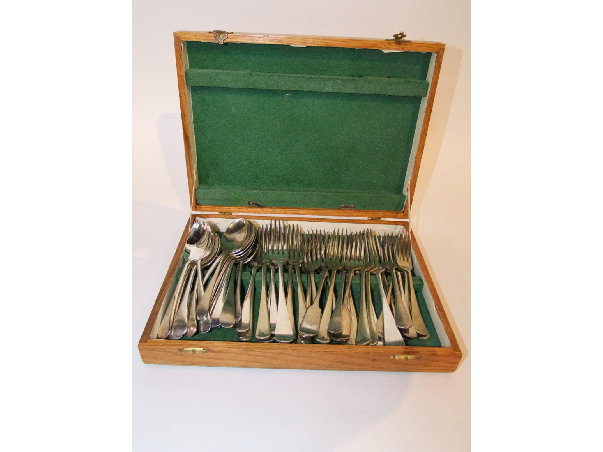 Appraisal: A pale oak cutlery box containing electro plated dinner forks