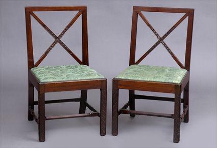 Appraisal: PAIR OF CHIPPENDALE-STYLE CARVED MAHOGANY SIDE CHAIRS Each open x-form