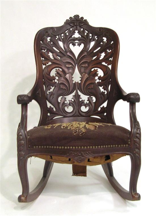 Appraisal: Victorian rocking chair with laminated pierced back with holly leaf