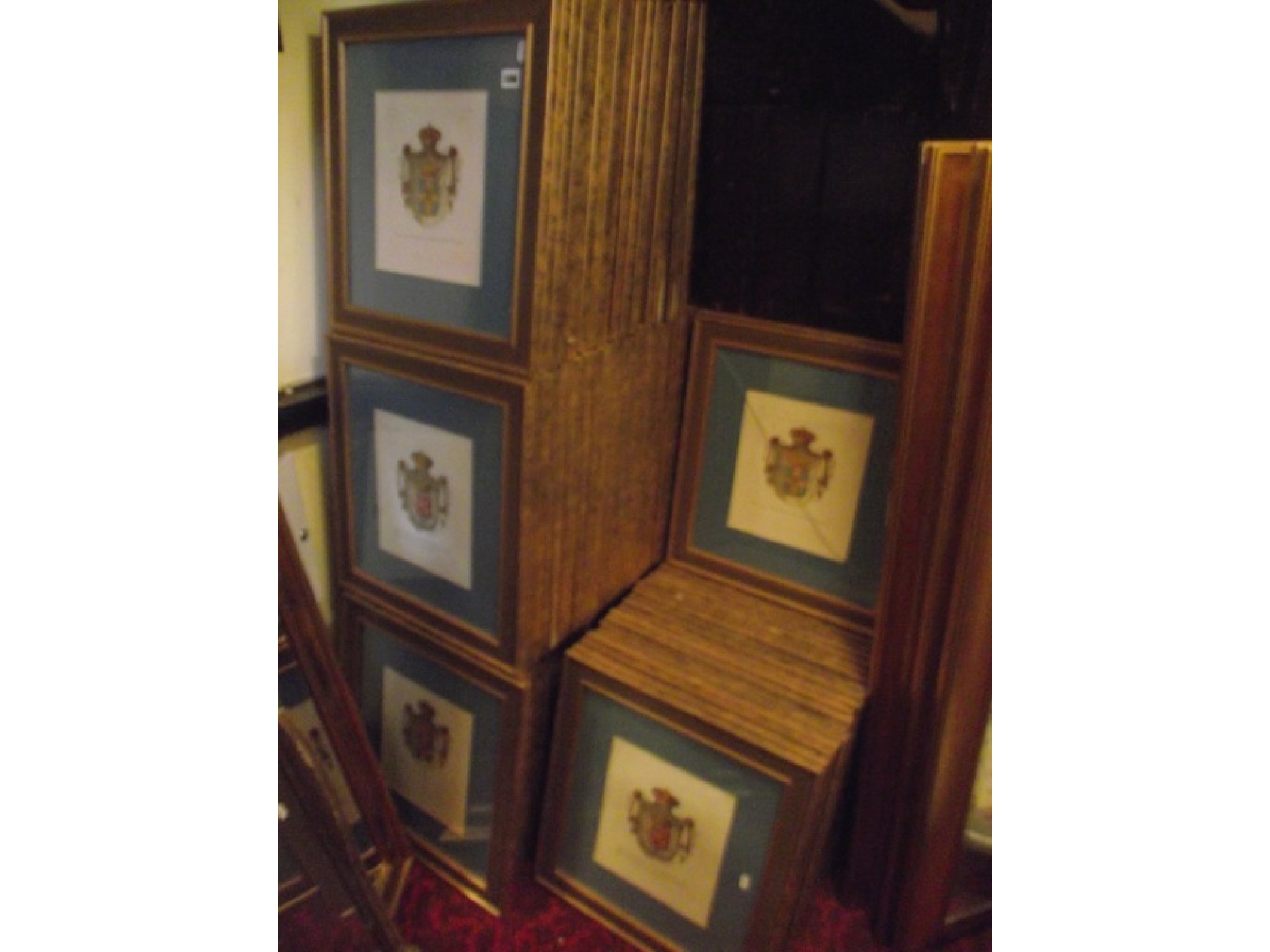 Appraisal: Approximately contemporary armorial coloured prints within gilt moulded frames