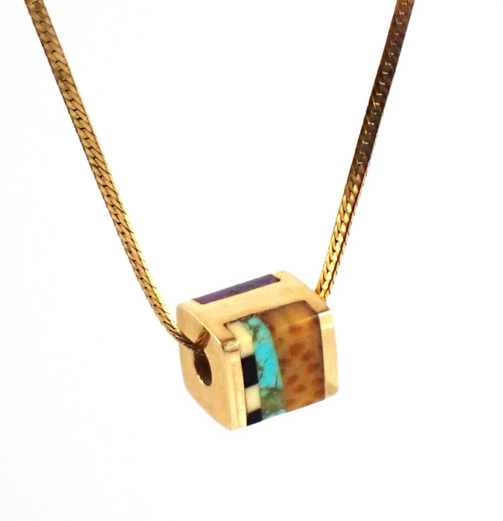 Appraisal: INLAID GEMSTONE AND FOURTEEN KARAT GOLD PENDANT NECKLACE with a