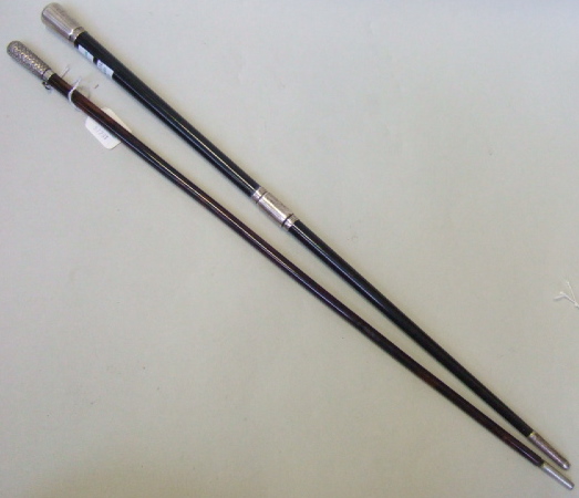 Appraisal: A Victorian tortoiseshell conductor's baton with basket weave white metal