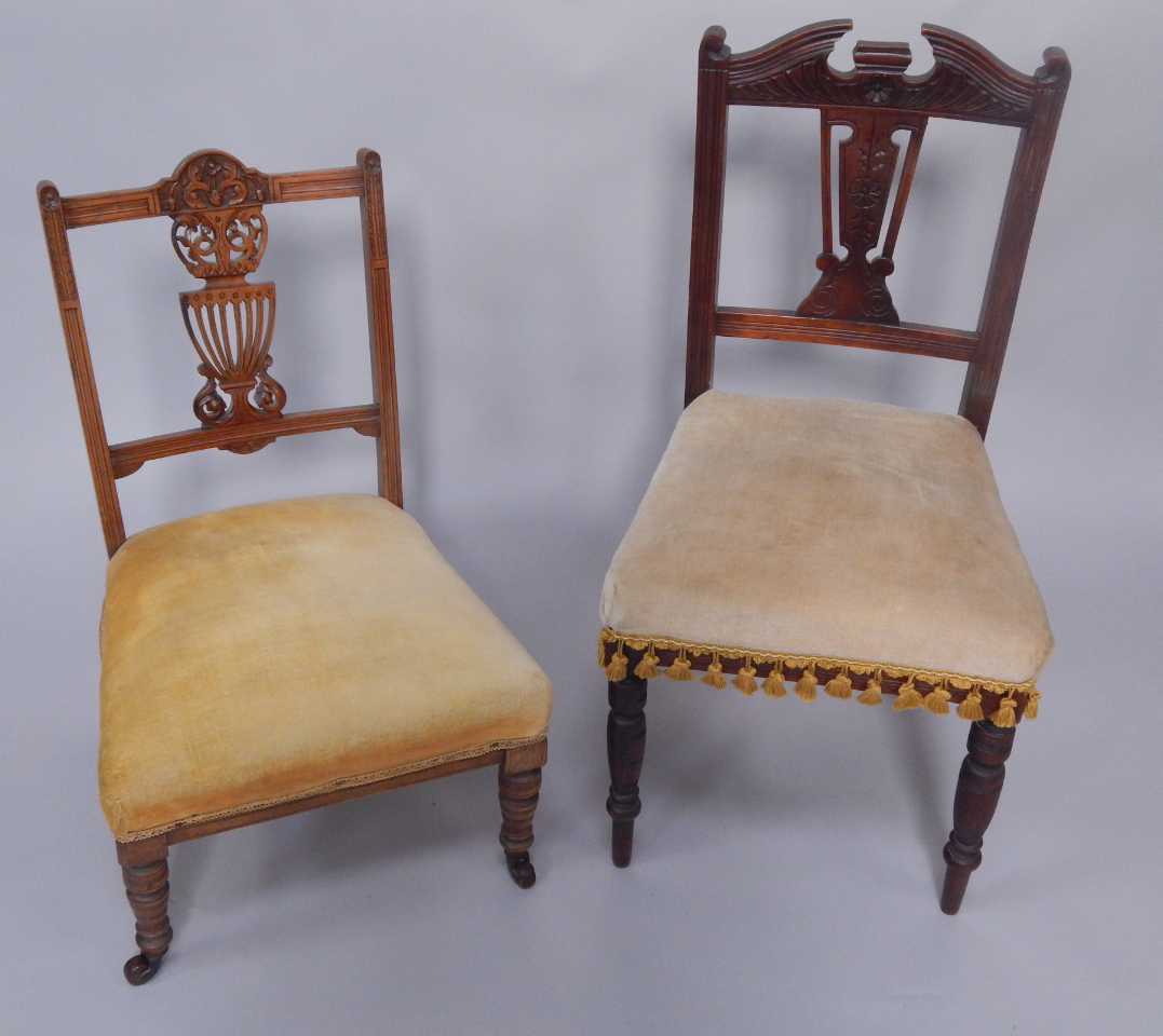 Appraisal: An Edwardian beech nursing chair with carved vase splat overstuffed