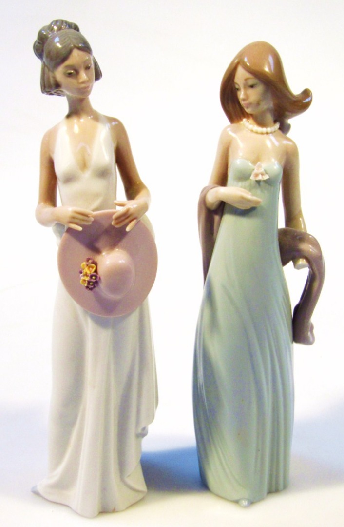 Appraisal: Two Lladro porcelain figures each wearing a evening dress one