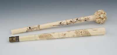 Appraisal: Two Carved Ivory Parasol Handles Tapered handle with carved tigers