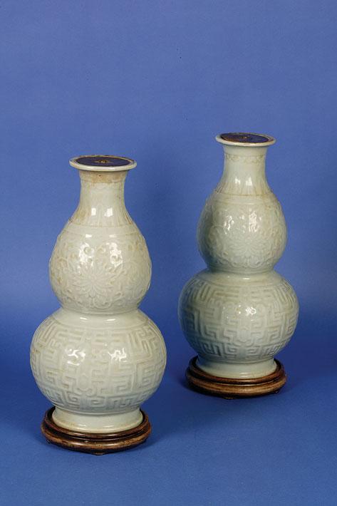 Appraisal: A PAIR OF GREEN CELADON DOUBLE GOURD VASES with moulded