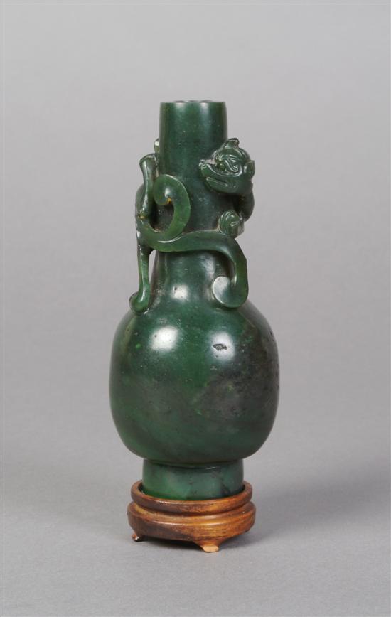 Appraisal: A Chinese Green Jade Vase with Hudra Height inches