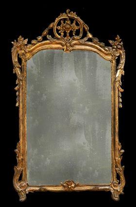 Appraisal: REGENCE CARVED GILTWOOD MIRROR The -part antiqued glass plate within