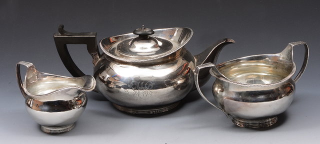 Appraisal: A SILVER THREE PIECE TEA SET of plain circular form