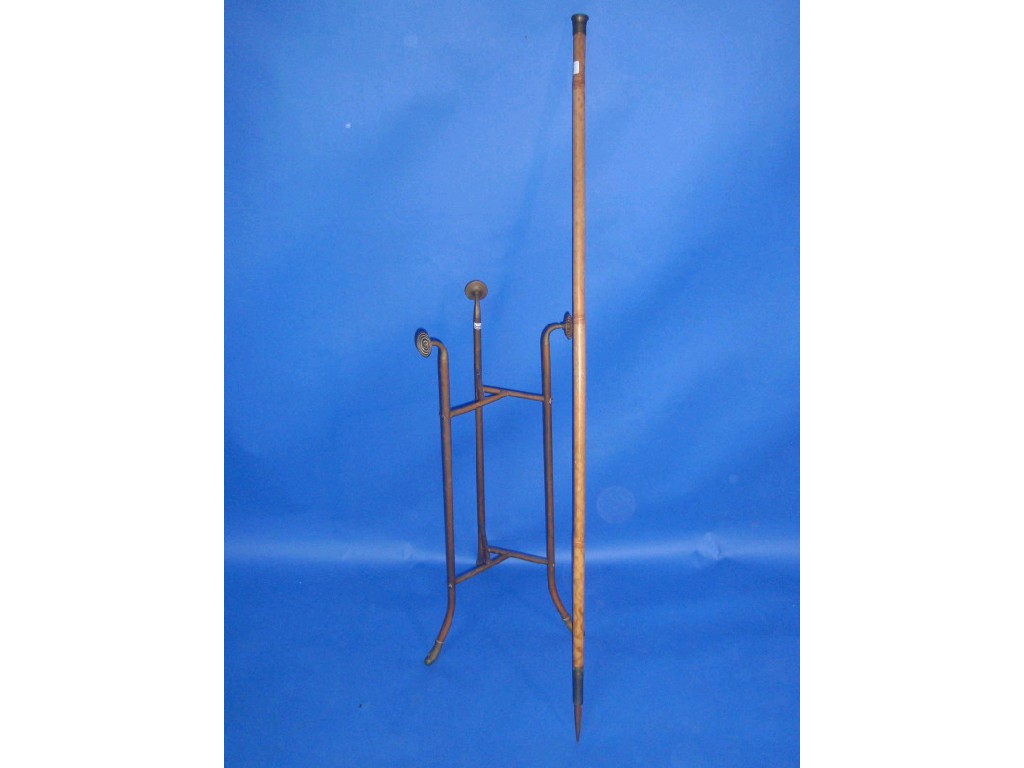 Appraisal: A brass tripod stand and a brass knopped Victorian ranging