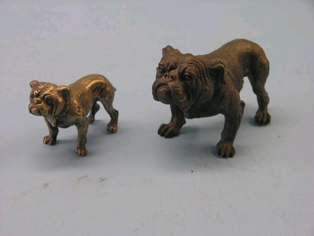 Appraisal: A cast bronze bulldog in and a similar silvered bronze