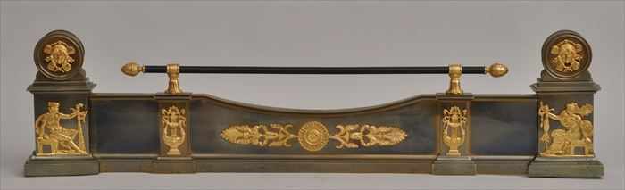 Appraisal: EMPIRE-STYLE GILT-METAL MOUNTED STEEL FIRE FENDER The front with dipped