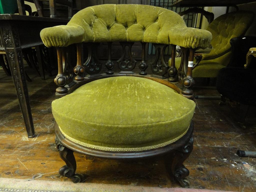 Appraisal: A Victorian rosewood tub chair with circular upholstered seat and