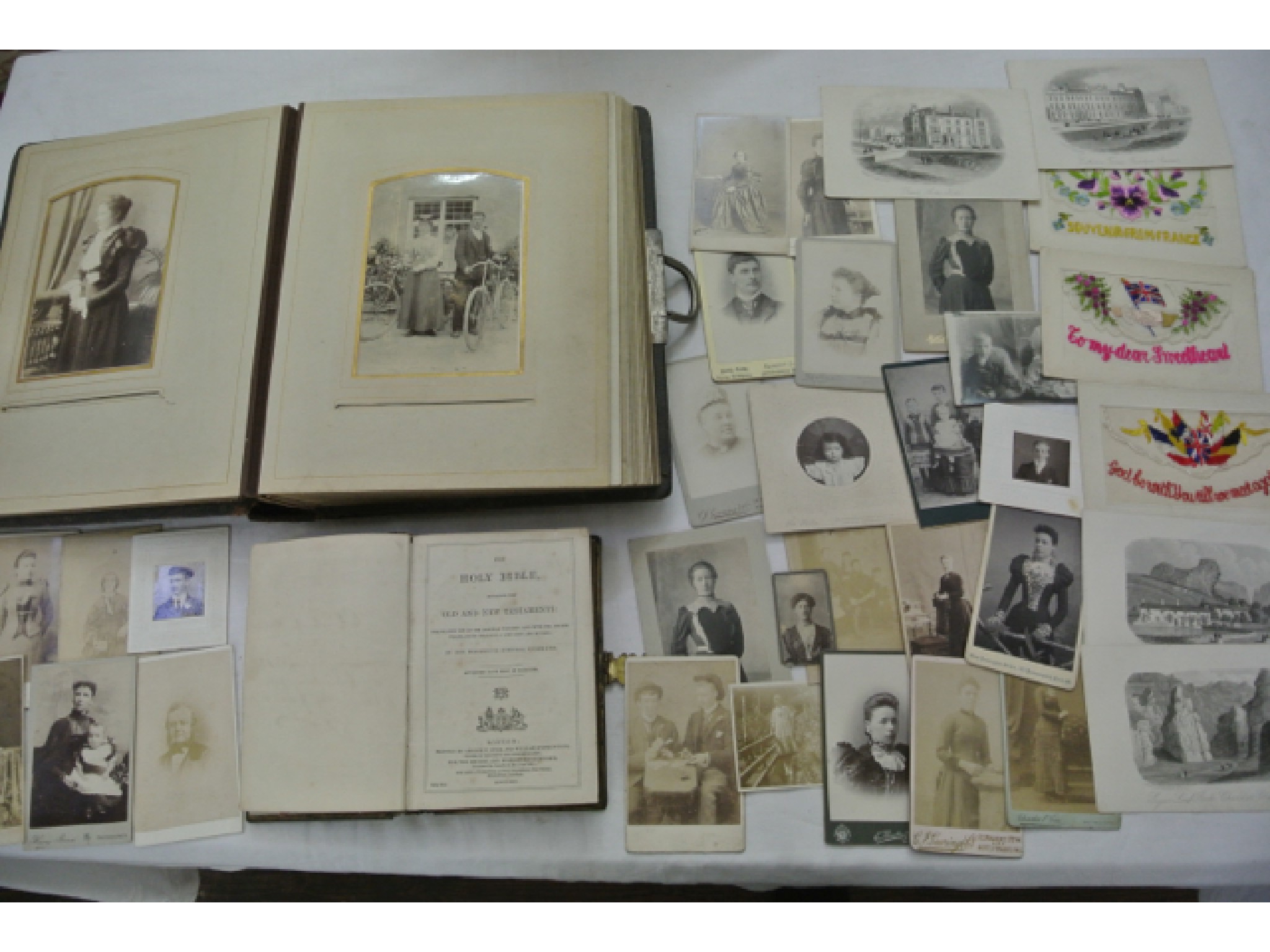 Appraisal: A Victorian embossed leather photographic portrait album together with a