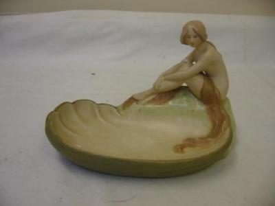 Appraisal: A ROYAL DUX PORCELAIN FIGURAL DISH of oval form flanked