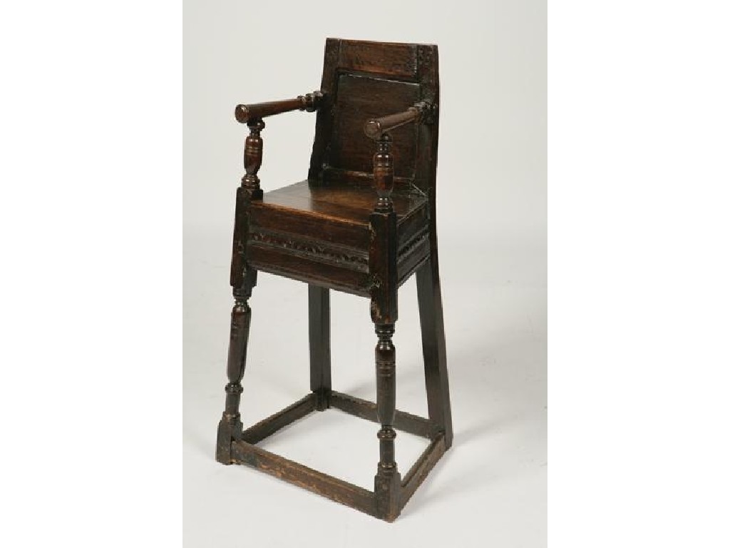 Appraisal: A CHARLES I CHILD'S HIGHCHAIR the back carved with the