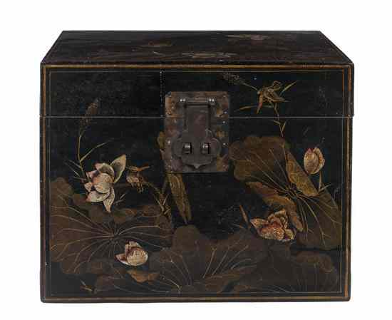 Appraisal: A Chinese Lacquered Trunk decorated throughout with lotus blossoms in