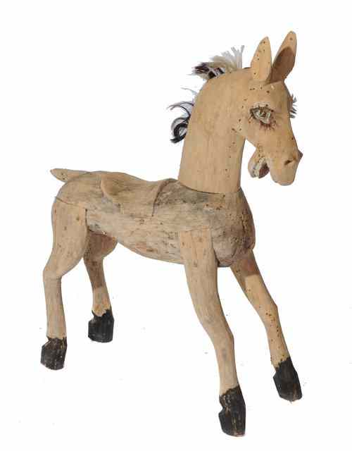 Appraisal: AN OLD CARVED WOODEN HORSE with remnants of a mane