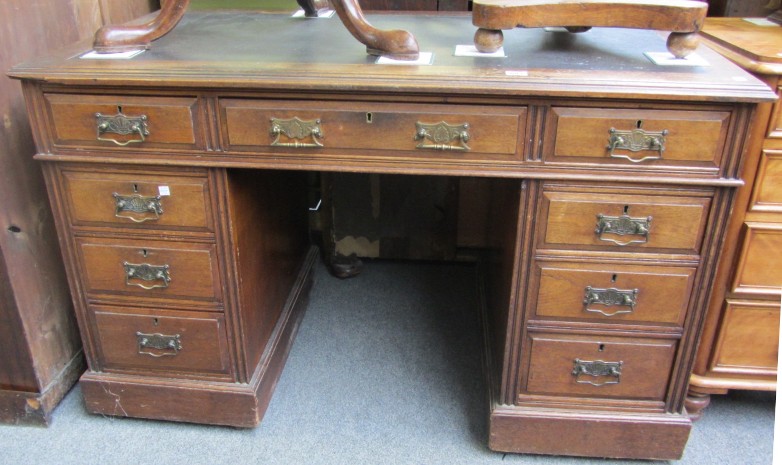 Appraisal: A late th century walnut pedestal desk with nine drawers