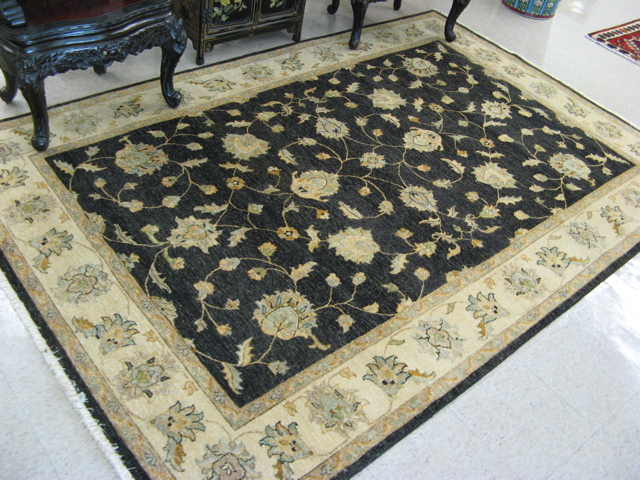 Appraisal: HAND KNOTTED ORIENTAL CARPET Pakistani-Persian overall scrolling floral raceme design