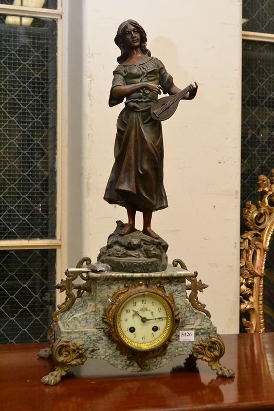 Appraisal: A NAPOLEON III CLOCK WITH A BRONZED LADY WITH LUTE