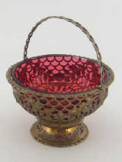 Appraisal: A silver swing handled sweetmeats basket on spread foot with