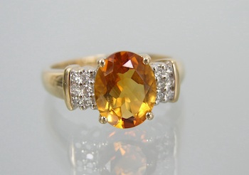 Appraisal: A Golden Citrine and Diamond Ring k yellow gold ring