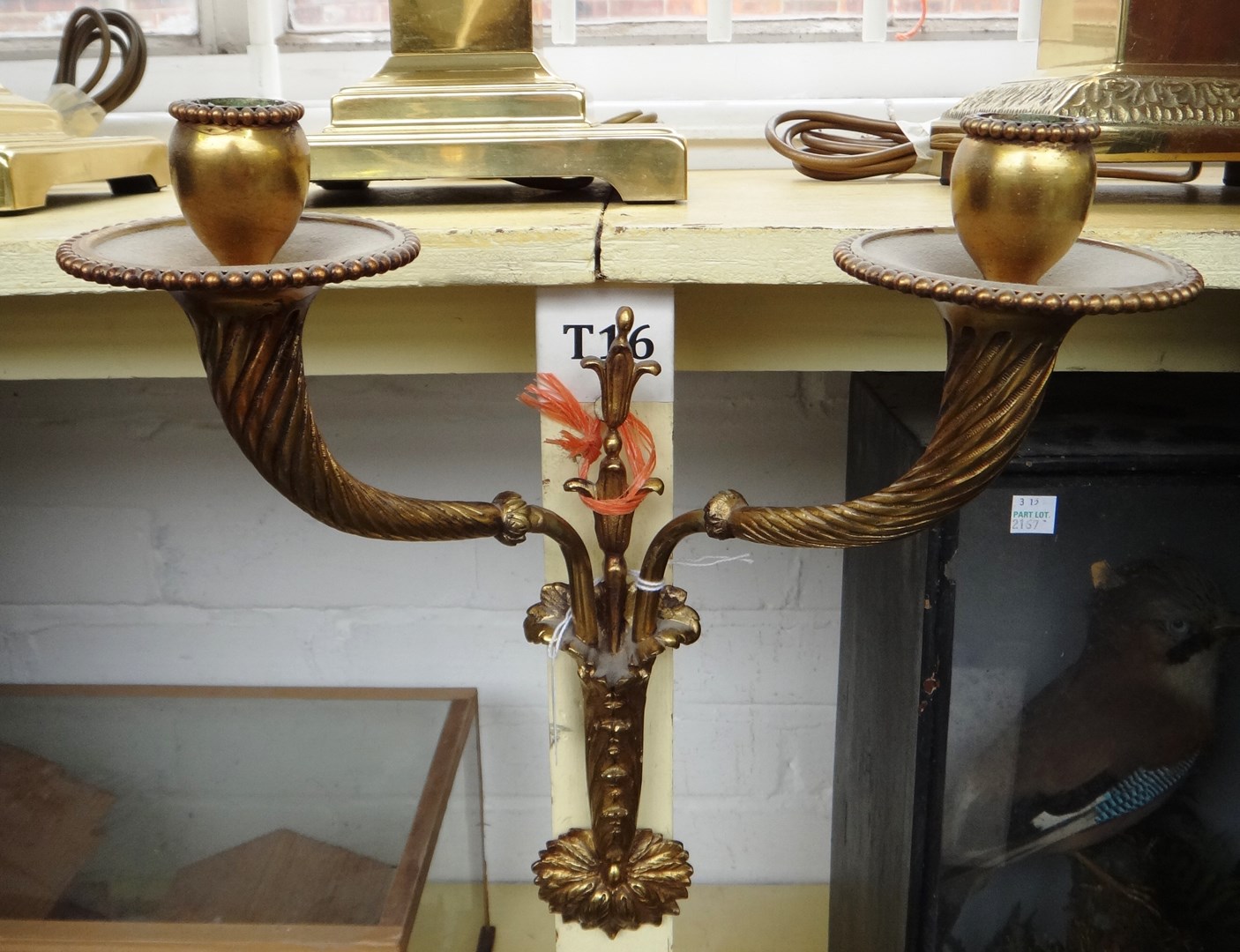 Appraisal: A pair of gilt bronze two branch wall lights of