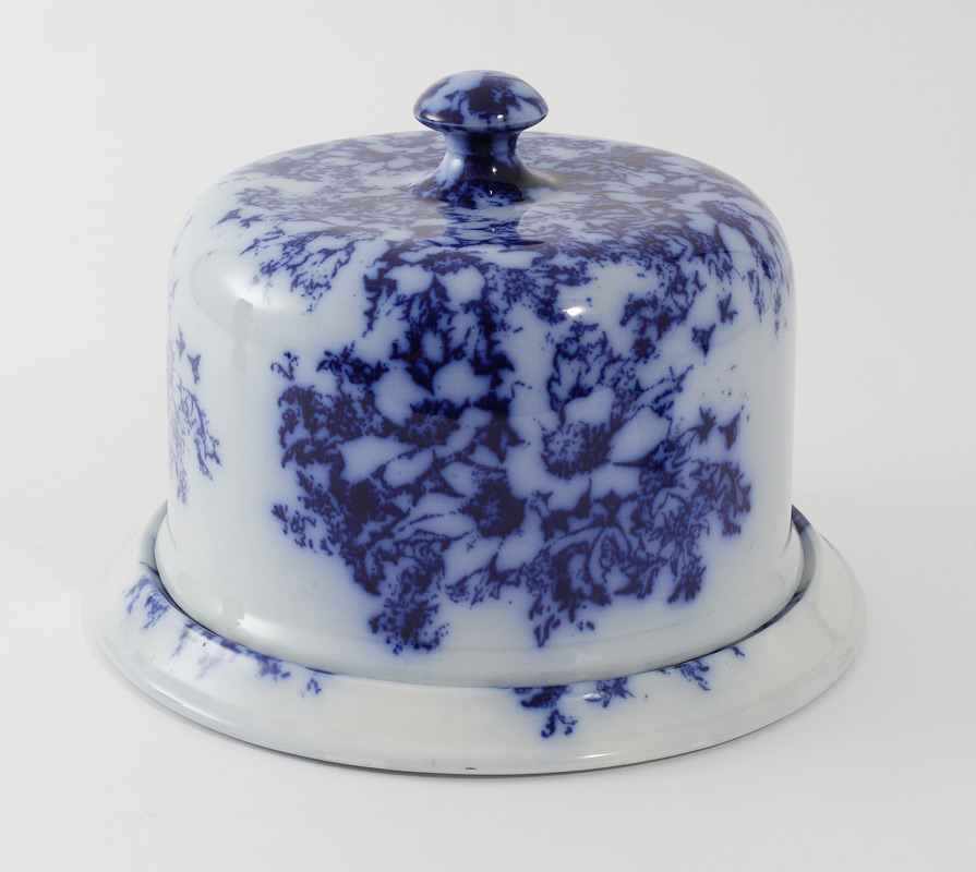 Appraisal: FLOW BLUE FLORAL CHEESE DISH Covered cheese dish with a