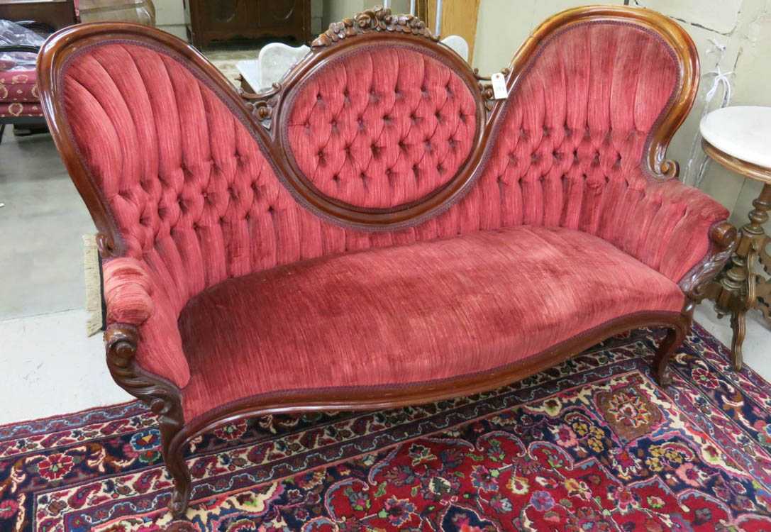 Appraisal: A VICTORIAN STYLE MEDALLION-BACK SOFA American mid- th century having