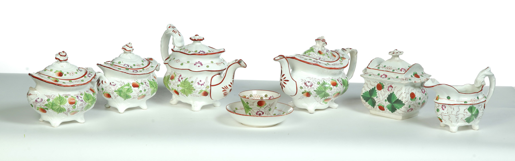 Appraisal: GROUP OF STRAWBERRY PATTERN EARTHENWARE England mid th century Mismatched