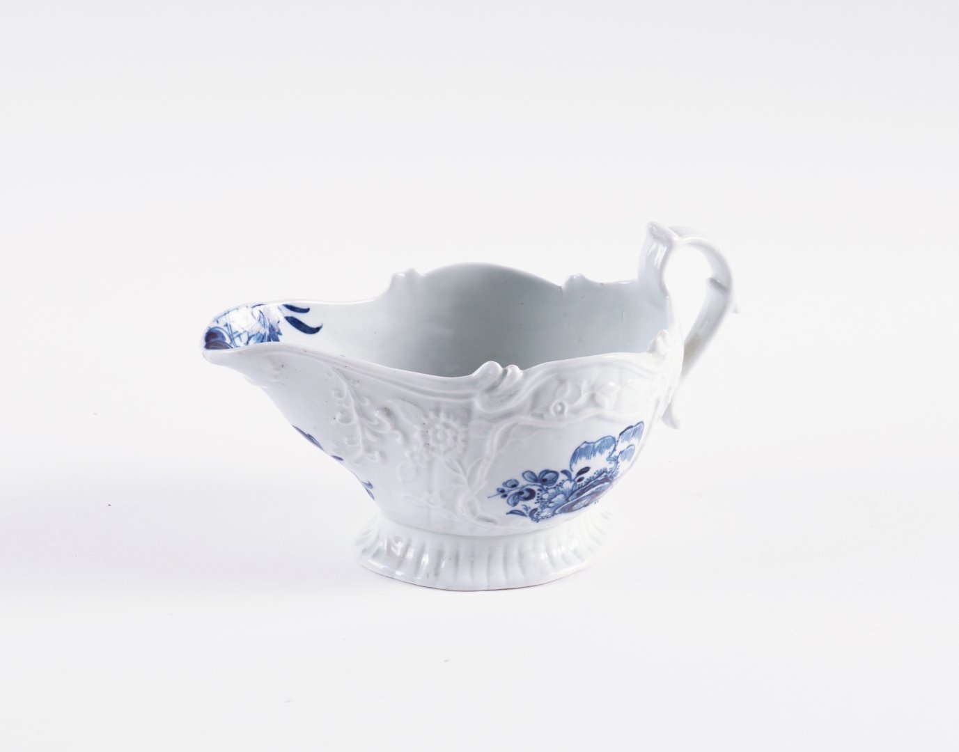 Appraisal: A CHRISTIAN'S LIVERPOOL BLUE AND WHITE SAUCEBOAT Circa Each side