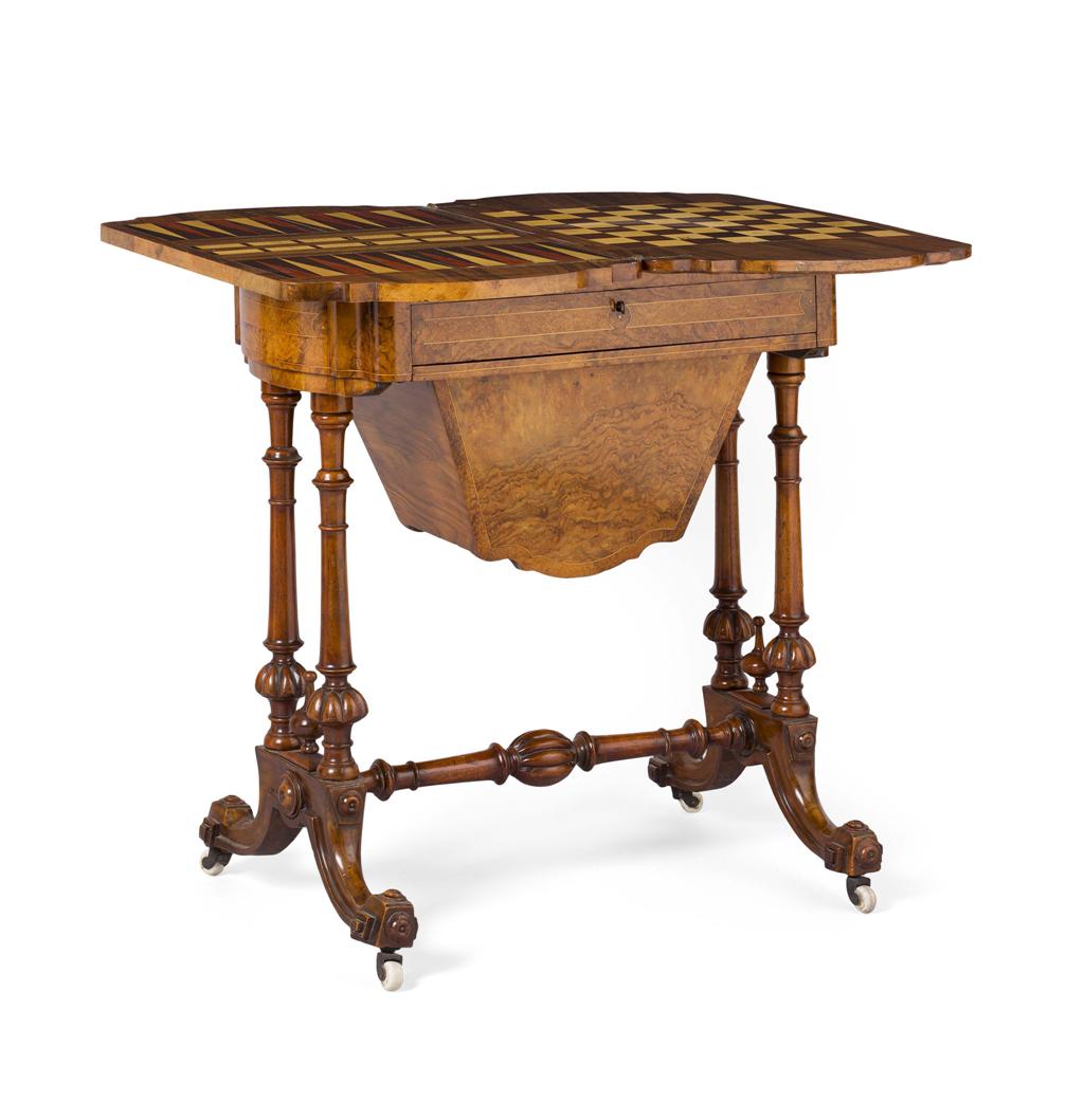 Appraisal: VICTORIAN WALNUT WORK GAMES TABLE TH CENTURY the pivoting foldover