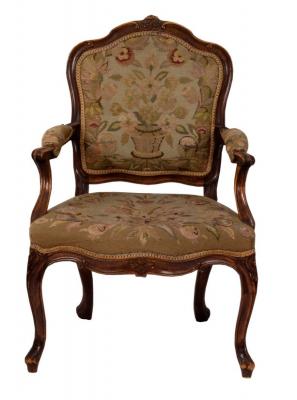 Appraisal: A carved beechwood framed fauteuil with needlework panel back seat