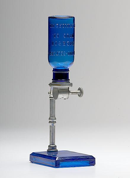 Appraisal: BROMO-SELTZER DISPENSER IN STAND cobalt Underside of base reads Property