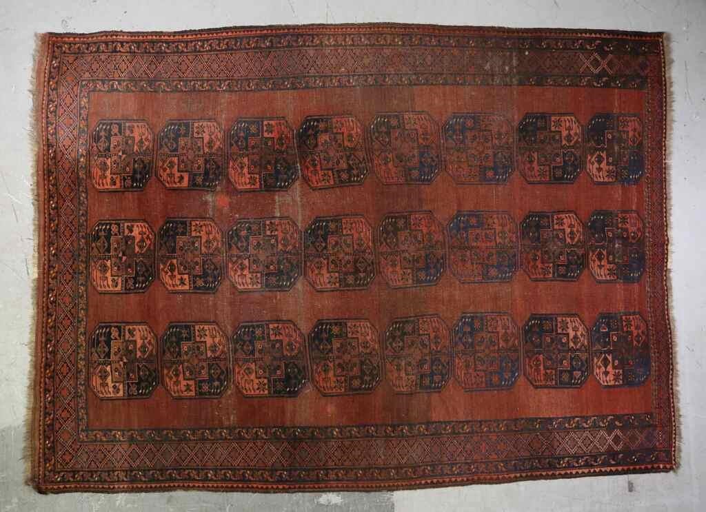 Appraisal: Bokhara style rug th century medallions on burgundy field Fading