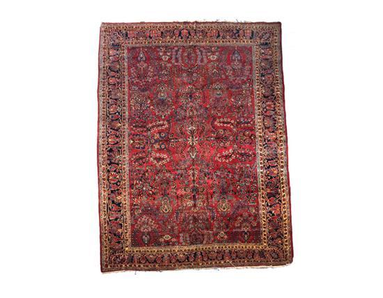 Appraisal: ORIENTAL RUG Room size Sarouk Dark blue border and burgundy