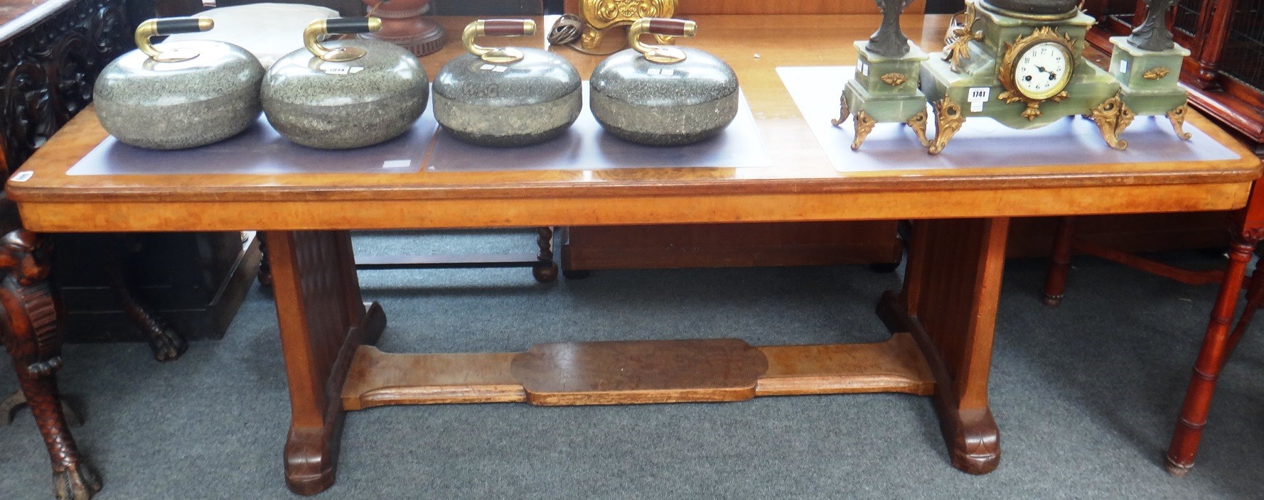 Appraisal: An Art Deco walnut and specimen wood veneered dining table