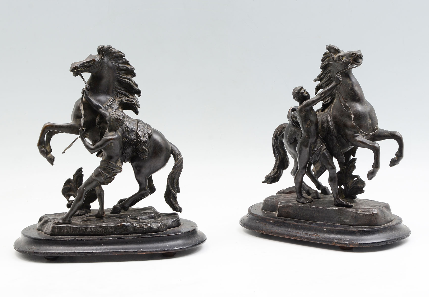 Appraisal: TWO MARLEY HORSE PATINATED METAL SCULPTURES AFTER COUSTOU Patinated metal