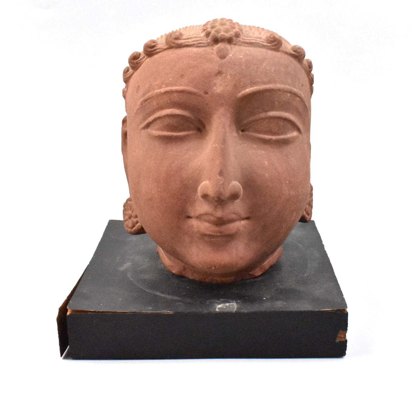 Appraisal: An antique Indian red sandstone head dated to the th