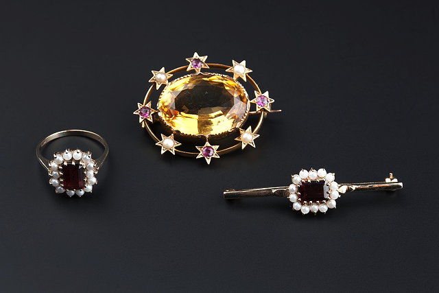 Appraisal: TWO GEM SET BROOCHES AND A CLUSTER RING the first