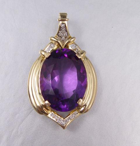 Appraisal: K DIAMOND AND AMETHYST PENDANT K yellow gold pendant enhancer