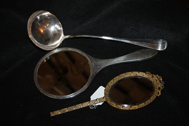 Appraisal: A SILVER BACKED HAND MIRROR together with a silver plated