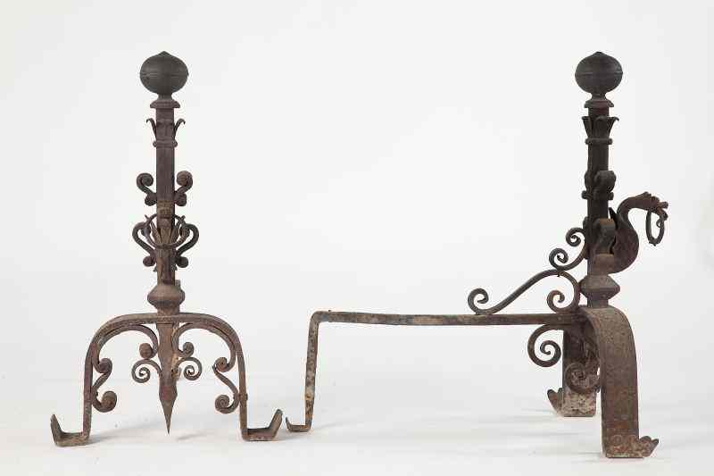 Appraisal: Pair of Italian Baroque Style Andironscirca wrought iron featuring winged