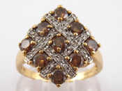 Appraisal: A carat gold brown and white diamond ring