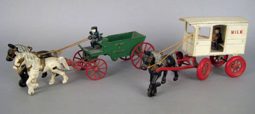 Appraisal: Cast iron milk wagon toy together with a Sand Gravel