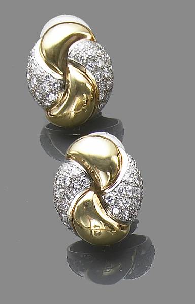 Appraisal: A pair of diamond and two-tone k gold ear clips